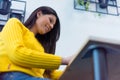 Young American business woman sitting at her desk and smiling Royalty Free Stock Photo