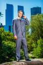 Young American Businessman talking on cell phone, traveling, working in New York