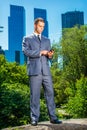 Young American Businessman texting on cell phone, traveling, working in New York