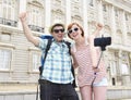 Young American couple enjoying Spain holiday trip taking selfie photo self portrait with mobile phone Royalty Free Stock Photo