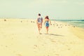 Young American Couple running, relaxing on the beach in New Jersey, USA Royalty Free Stock Photo