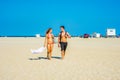 Young American Couple traveling, relaxing on the beach in New Jersey, USA Royalty Free Stock Photo