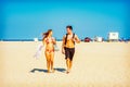 Young American Couple traveling, relaxing on the beach in New Jersey, USA Royalty Free Stock Photo