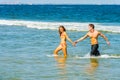 Young American Couple traveling, relaxing on the beach in New Jersey, USA Royalty Free Stock Photo