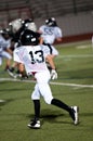 Young american football player on defense. Royalty Free Stock Photo