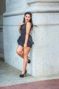 Young American girl standing on vintage street in New York in summer, relaxing