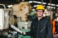 Young American happy labor worker enjoy smiling to work in industrial factory for heavy machine operator Royalty Free Stock Photo