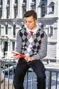 Young American Man Reading Outside in New York Royalty Free Stock Photo