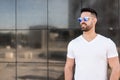 Young american man smiling happy with sunglasses portrait outdoor