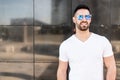 Young american man smiling happy with sunglasses portrait outdoor