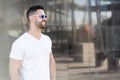 Young american man smiling happy with sunglasses portrait outdoor