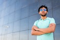 Young american man smiling happy with sunglasses portrait outdoor