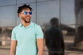 Young american man smiling happy with sunglasses portrait outdoor