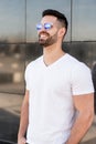 Young american man smiling happy with sunglasses portrait outdoor