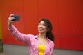 Young american woman taking selfie in Time square Royalty Free Stock Photo