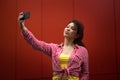 Young american woman taking selfie in New york, Time square Royalty Free Stock Photo