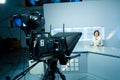 Young anchorwoman at TV studio Royalty Free Stock Photo