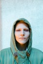 Young Androgyne Woman with short blond hair on the street