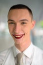 Young androgynous homosexual LGTB businessman wearing lipstick and smiling