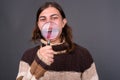 Young androgynous man with long hair ready for winter Royalty Free Stock Photo