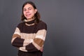 Young androgynous man with long hair ready for winter Royalty Free Stock Photo