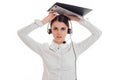 Young angry business woman in uniform with headphones and microphone looking at the camera and screaming isolated on Royalty Free Stock Photo