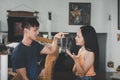 Young angry couple arguing shouting blaming each other into an argument in the living room Royalty Free Stock Photo