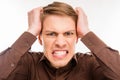 Young angry furios man toucing his head, close up photo Royalty Free Stock Photo