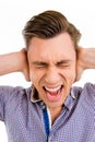 Young angry furios man toucing his head, close up photo Royalty Free Stock Photo