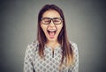 Young angry hysterical woman screaming in frustrtaion Royalty Free Stock Photo