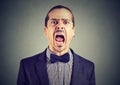Young angry man screaming with wide open mouth Royalty Free Stock Photo