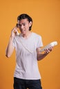 Young angry man talking on landline phone Royalty Free Stock Photo