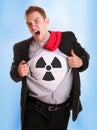 Young angry businessman tearing his shirt - radioactive symbol on it Royalty Free Stock Photo