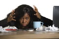 Young angry and upset black African American business woman working in stress at office computer desk feeling desperate and exhaus Royalty Free Stock Photo