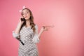 Young angry woman pastry chef communicates with customers by phone, take orders, entrepreneur. Royalty Free Stock Photo