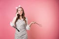 Young angry woman pastry chef communicates with customers by phone, take orders, entrepreneur. Royalty Free Stock Photo