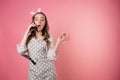 Young angry woman pastry chef communicates with customers by phone, take orders, entrepreneur. Royalty Free Stock Photo