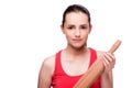 The young angry woman with rolling pin isolated on white Royalty Free Stock Photo