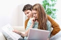 Young anxious couple consults their bank account Royalty Free Stock Photo