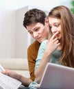 Young anxious couple consults their bank account Royalty Free Stock Photo