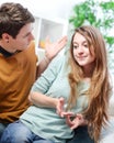 Young anxious couple quarrels by consulting their bank account Royalty Free Stock Photo
