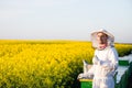 Young apiarist gesturing thumb up Royalty Free Stock Photo