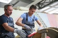 Young apprentice with instructor of masonry