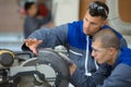 young apprentice learning to use circular saw Royalty Free Stock Photo