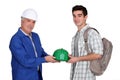Young apprentice and mature workmate Royalty Free Stock Photo