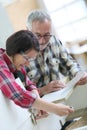 Young apprentice with senior carpentry craftsman Royalty Free Stock Photo