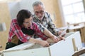 Young apprentice with senior craftsman of carpentry Royalty Free Stock Photo