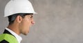 Young arab architect inspector man wearing builder safety helmet frustrated shouting with anger, crazy and yelling