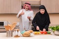 The young arab family in the kitchen