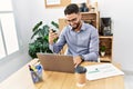 Young arab man smiling confident having video call working at office Royalty Free Stock Photo